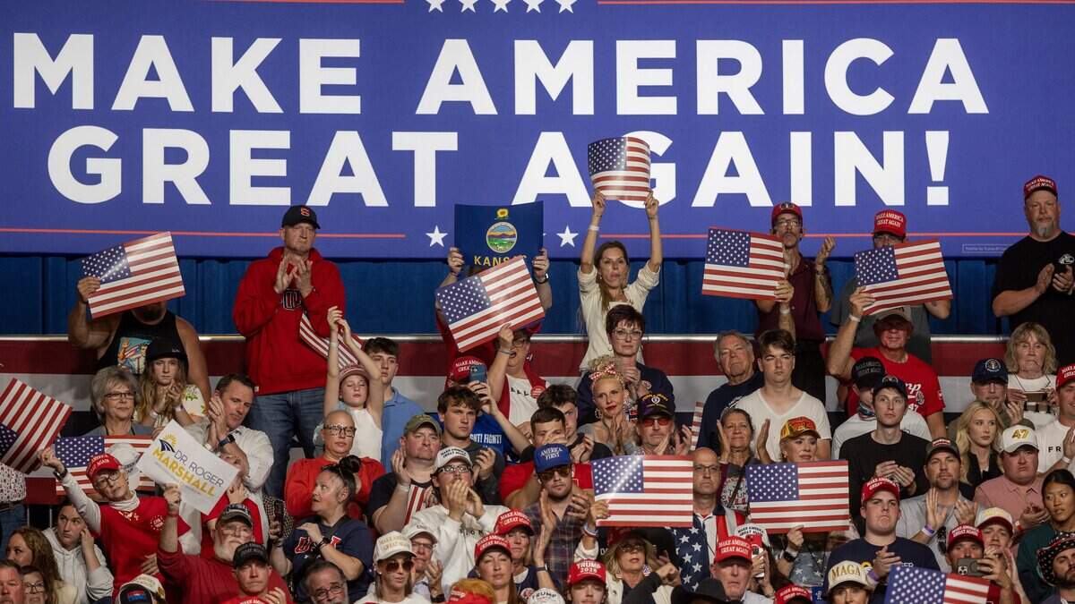 The crowd cheers for President Trump at his rally at Heartland Credit Union Arena on Monday.